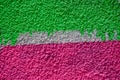 Minimalist textured background with sprayed painted wall like graffiti art, made with with vivid pink and green colors Royalty Free Stock Photo