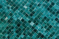 Minimalist textured monochrome background of old green teal mosaic tiles in horizontal display