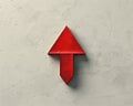 Minimalist thick red arrow pointing down on light grey canvas with subtle shadow, conveying descent Royalty Free Stock Photo