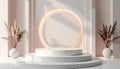 A minimalist three tier white cylindrical podium setup illuminated by soft sunlight and centered against a blush pink wall Royalty Free Stock Photo