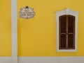 A minimalist view of a Portuguese house front with road sign Royalty Free Stock Photo