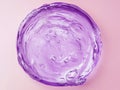 Minimalist violet blue shimmer gel texture on light pink background Royalty Free Stock Photo