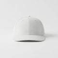Minimalist white baseball cap displayed against a plain background Royalty Free Stock Photo