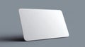 Minimalist white blank gift card mockup with subtle shadow on a gray background. Royalty Free Stock Photo