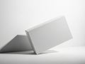 Minimalist white box casting shadow on plain surface Royalty Free Stock Photo
