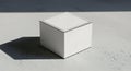 Minimalist White Box on Textured Surface with Dramatic Shadow and Light Royalty Free Stock Photo