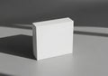 Minimalist white box on textured surface with shadows Royalty Free Stock Photo