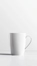 Minimalist white ceramic mug on light background Royalty Free Stock Photo