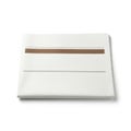Minimalist white ceramic plate with copper accent Royalty Free Stock Photo