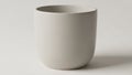 Minimalist white ceramic pot with a smooth surface and rounded Royalty Free Stock Photo