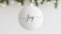 Joy text on minimalist white christmas ornament for holiday marketing Royalty Free Stock Photo