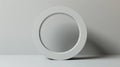 Minimalist white circular object on a neutral background Royalty Free Stock Photo