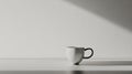 Minimalist white coffee mug on clean surface with dramatic lighting and shadows Royalty Free Stock Photo