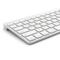 A minimalist white computer keyboard with a slim profile and flat keys Royalty Free Stock Photo