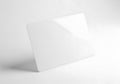Minimalist white cube casting a soft shadow on a seamless white background Royalty Free Stock Photo
