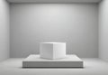 Minimalist White Cube Display Pedestal With Soft Overhead Spotlight In An Empty Studio Room Royalty Free Stock Photo