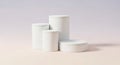 Minimalist white cylinders and round containers on a soft gradient background Royalty Free Stock Photo
