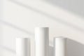 Minimalist white cylinders with soft light and shadow patterns Royalty Free Stock Photo