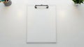 Minimalist White Desk Flat Lay with Blank Clipboard and Office Essentials Royalty Free Stock Photo