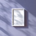 Minimalist White Frame Mockup with Natural Leaf Shadows on Purple Wall Royalty Free Stock Photo