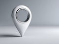 Minimalist white map pointer standing on a smooth surface with a reflective inner ring in a clean modern setting with ample Royalty Free Stock Photo