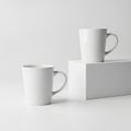 Minimalist white mugs on a simple surface Royalty Free Stock Photo