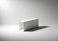 Minimalist white object casting a strong shadow on a grey background Royalty Free Stock Photo