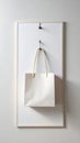 Minimalist White Paper Bag Hanging on Wall Mounted White Frame Royalty Free Stock Photo