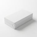 Minimalist white paper box on a plain surface Royalty Free Stock Photo