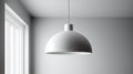 Minimalist white pendant lamp suspended from the ceiling with a window in the background. Royalty Free Stock Photo