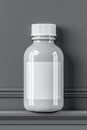 White plastic bottle with blank label on a textured gray background. Royalty Free Stock Photo