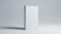Minimalist white rectangular block casting subtle shadow on plain surface Royalty Free Stock Photo