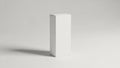 Minimalist white rectangular block casting a subtle shadow on a plain surface Royalty Free Stock Photo
