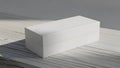 Minimalist White Rectangular Box Mockup on Wooden Surface Royalty Free Stock Photo