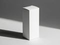Minimalist white rectangular box standing on a plain surface casting subtle shadows isolated on white background Royalty Free Stock Photo