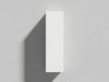 A minimalist white rectangular object casting a shadow on a light grey background Royalty Free Stock Photo