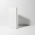 Minimalist white rectangular object casting a soft shadow on a plain background Royalty Free Stock Photo