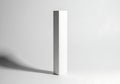 Minimalist white rectangular object with dramatic shadow on gray background Royalty Free Stock Photo