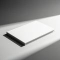 Minimalist white rectangular object illuminated by dramatic diagonal light and shadow Royalty Free Stock Photo