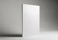 A minimalist white rectangular object standing upright against a gray background Royalty Free Stock Photo