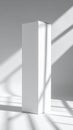 Minimalist White Rectangular Prism on White Background with Dramatic Sunlight and Shadows Striking Product Royalty Free Stock Photo