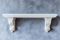 A minimalist white shelf is mounted on a light gray wall, creating a simple interior design setting Royalty Free Stock Photo