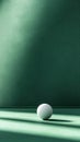 Minimalist white sphere on a green surface with dramatic lighting, AI Royalty Free Stock Photo