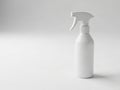 Minimalist white spray bottle with trigger nozzle on a plain background Royalty Free Stock Photo