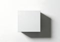 Minimalist white square box with dramatic shadow on white background Royalty Free Stock Photo