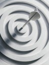 Minimalist white target with an arrow in the bullseye Royalty Free Stock Photo
