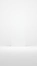 Minimalist white wall and floor space with subtle shadows and light effects Royalty Free Stock Photo