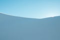 Minimalist winter landscape with sun rising in the mountains Royalty Free Stock Photo
