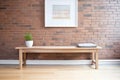 minimalist wood bench placed against an exposed brick hallway