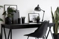 minimalist workplace black desk and chair modern style generative ai